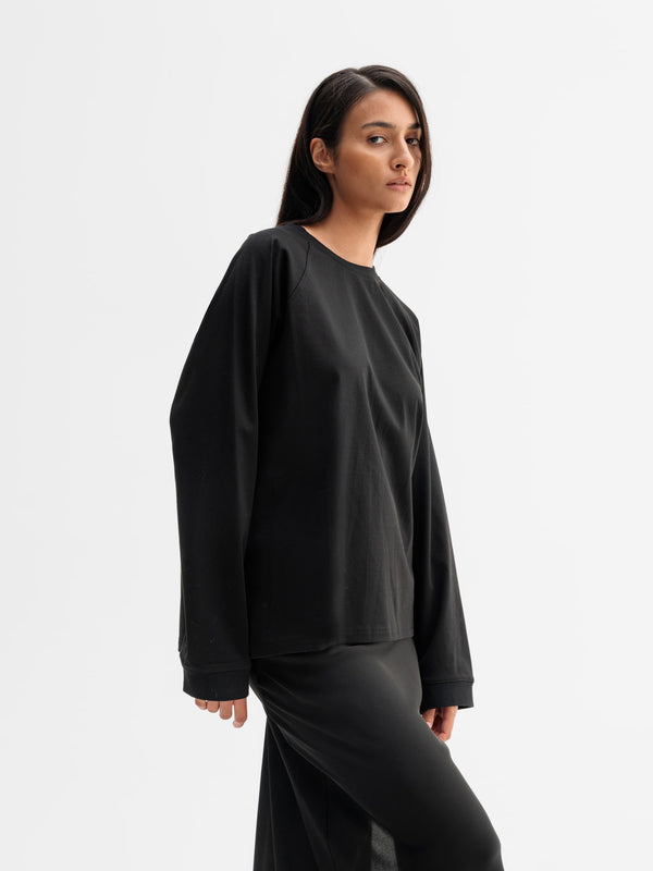 Model wearing Ahlvar Gallery Thelma LS tee in Black