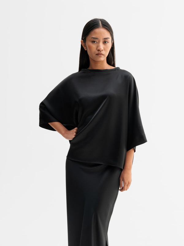 Model wearing Ahlvar Gallery Tori satin tee in Black