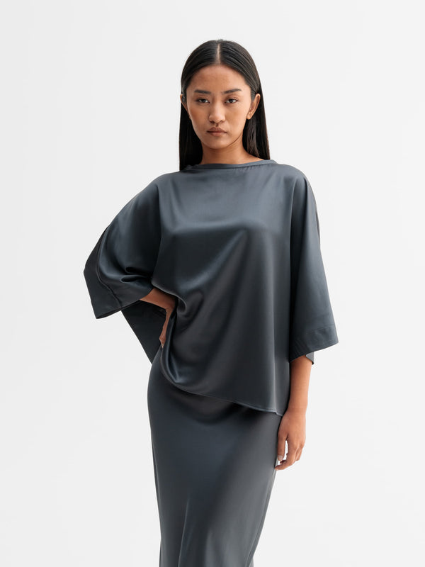 Model wearing Ahlvar Gallery Tori satin tee in Dark grey