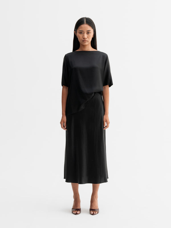 Model wearing Ahlvar Gallery Yoli silk blouse in Black