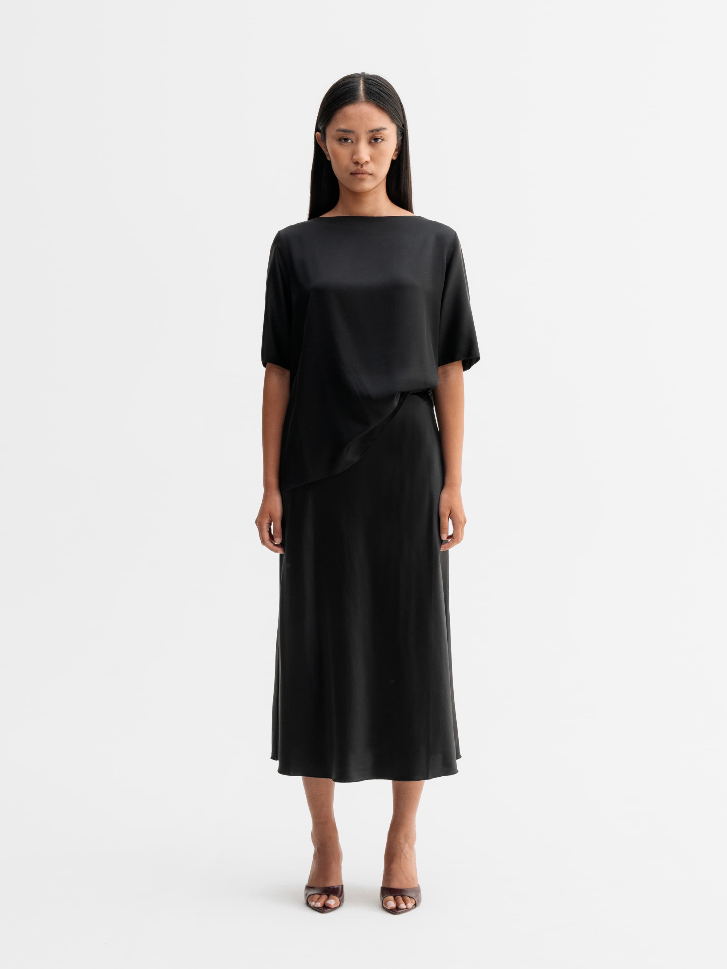 Model wearing Ahlvar Gallery Yoli silk blouse in Black