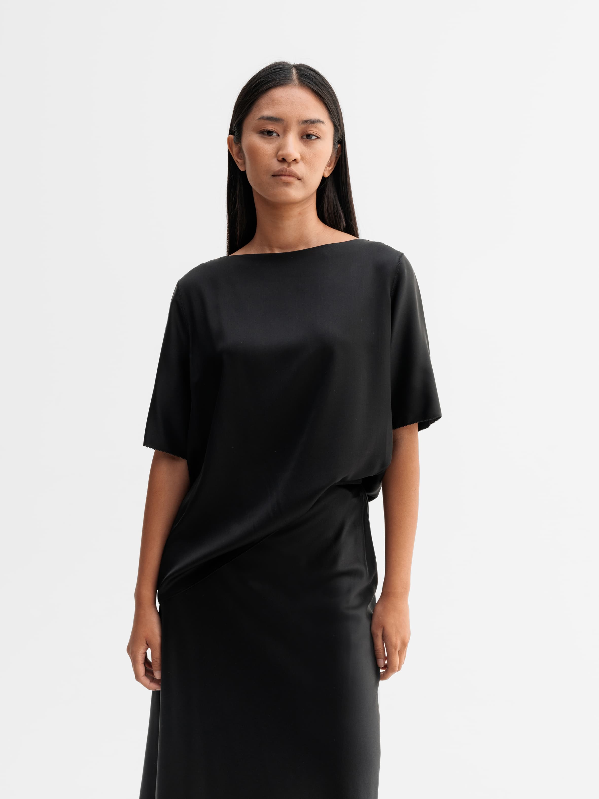 Model wearing Ahlvar Gallery Yoli silk blouse in Black