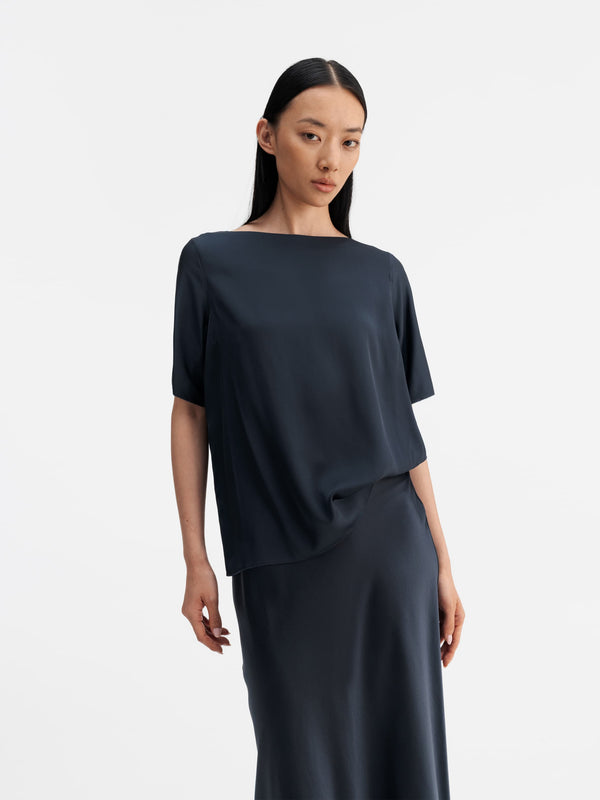 Model wearing Ahlvar Gallery Yoli silk blouse blue grey