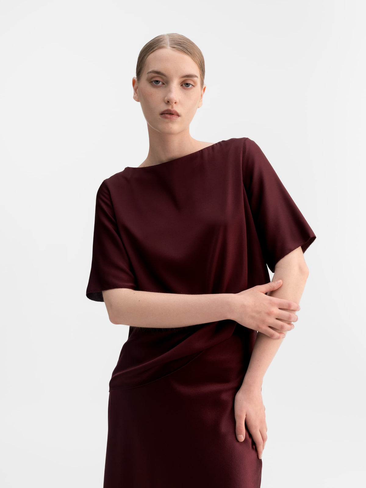 Model wearing Ahlvar Gallery Yoli silk blouse in Burgundy