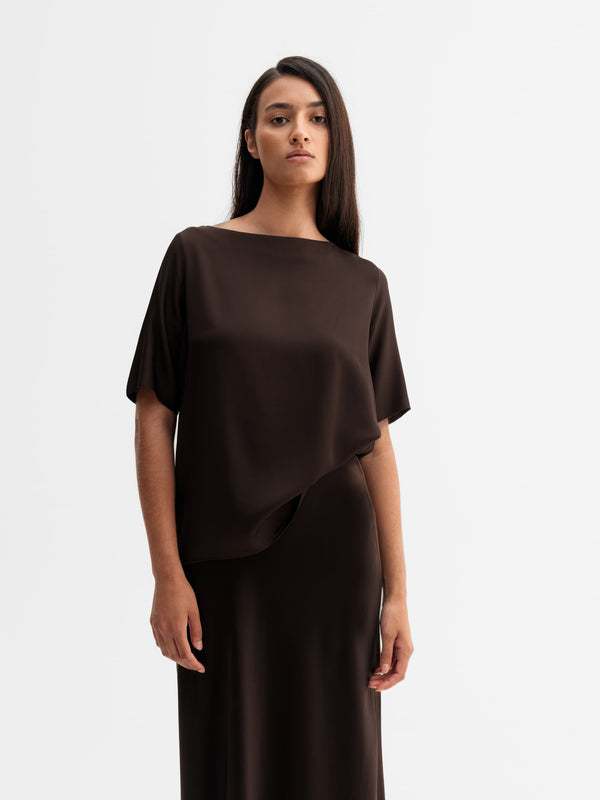 Model wearing Ahlvar Gallery Yoli silk blouse in Dark brown