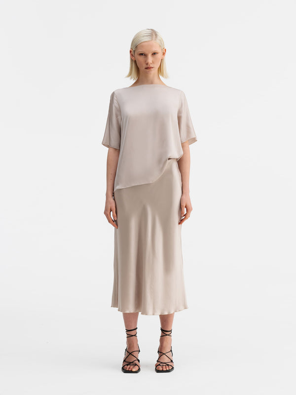 Model wearing Ahlvar Gallery Yoli silk blouse greige