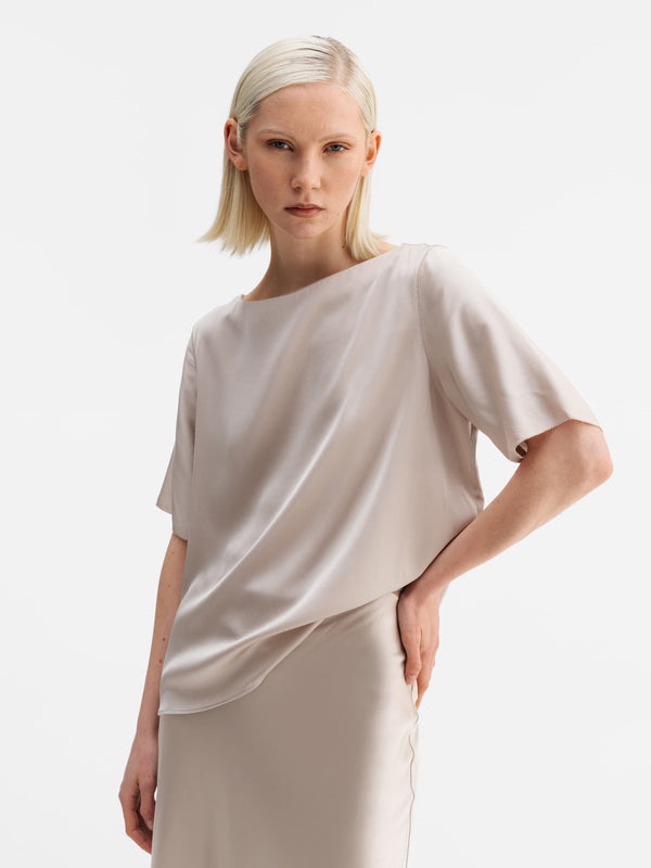 Model wearing Ahlvar Gallery Yoli silk blouse greige