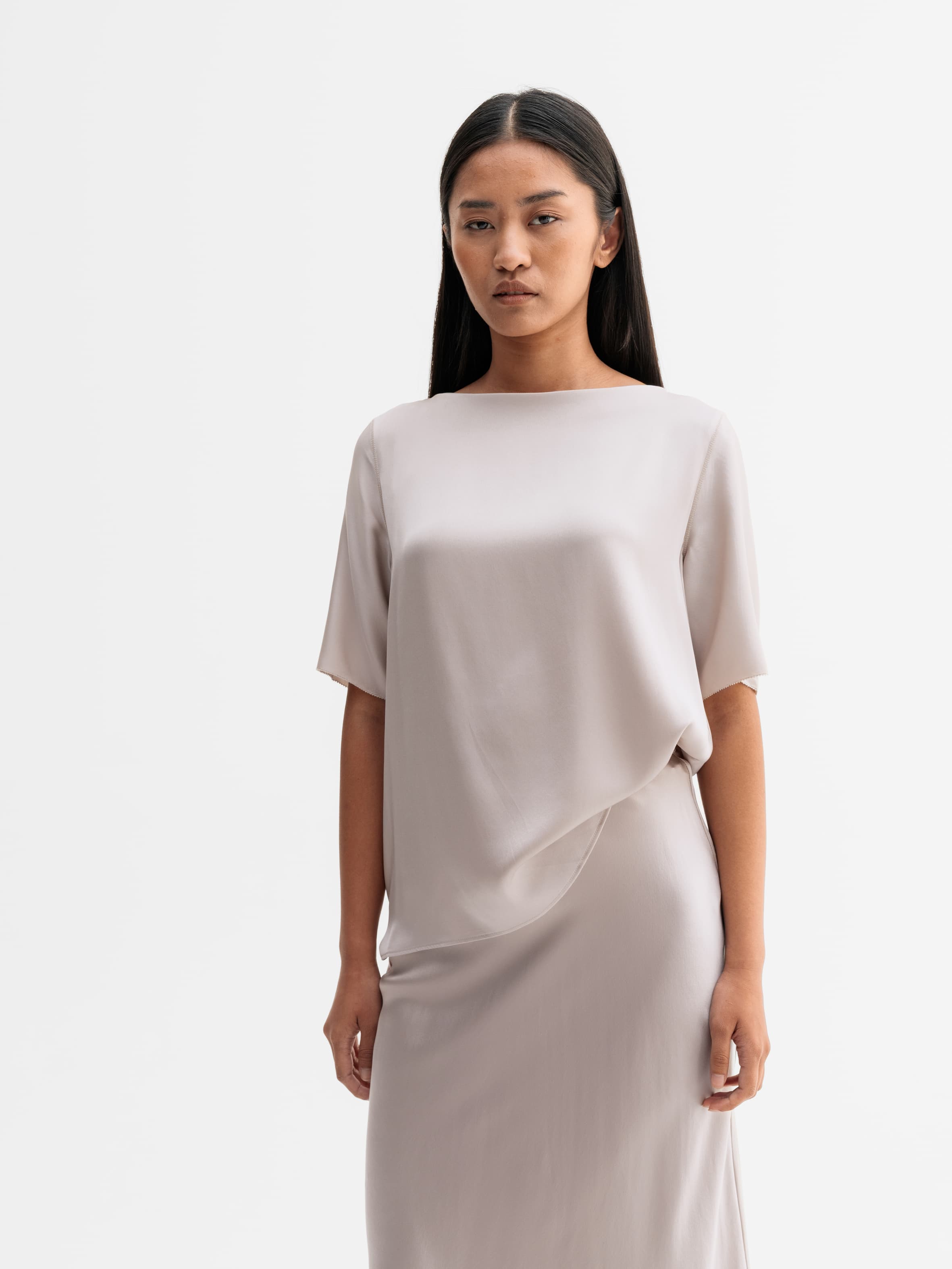 Model wearing Ahlvar Gallery Yoli silk blouse in Greige