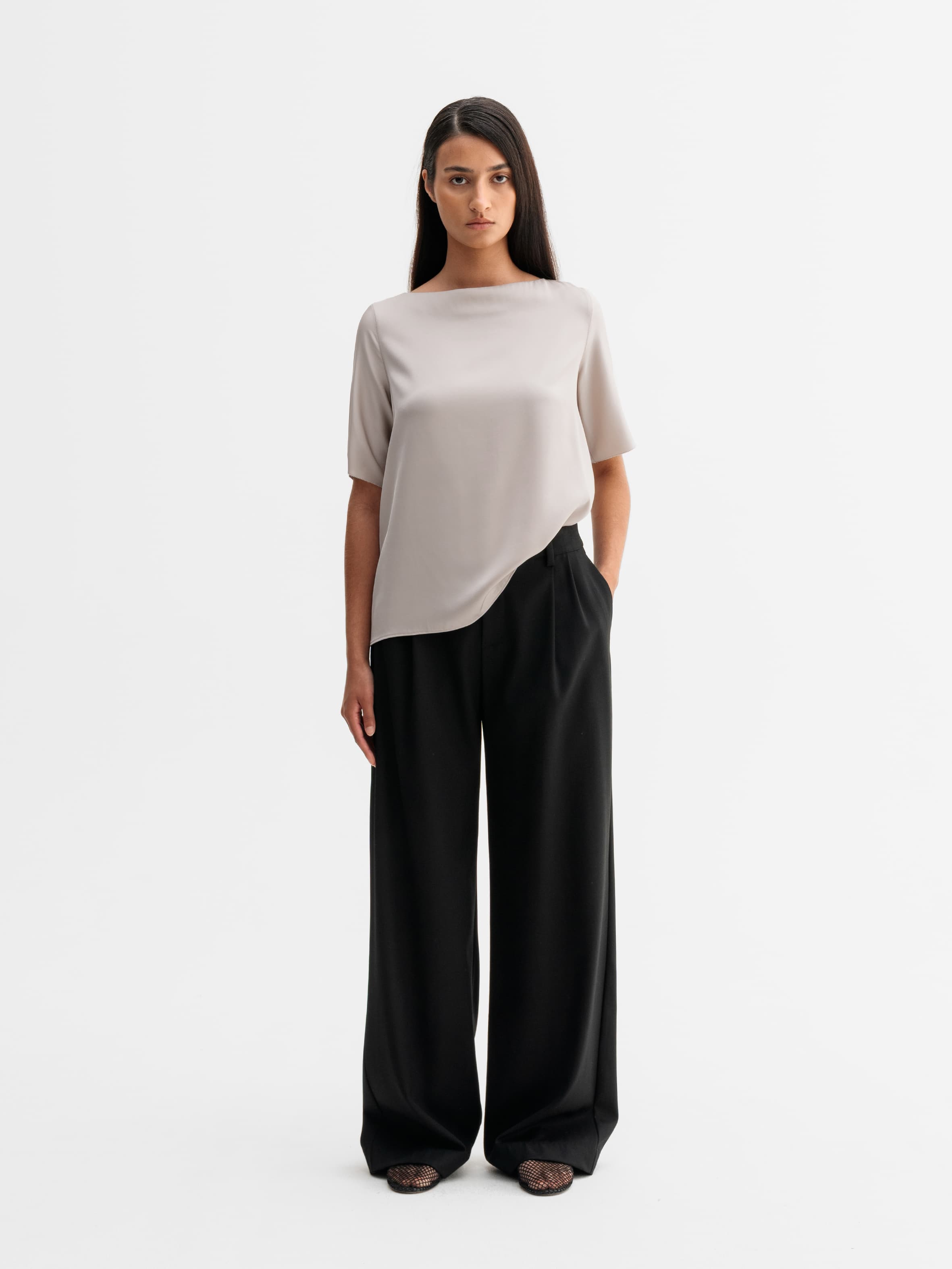 Model wearing Ahlvar Gallery Yoli silk blouse in Greige