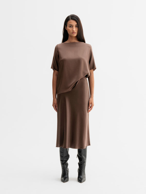 Model wearing Ahlvar Gallery Yoli silk blouse in Light brown