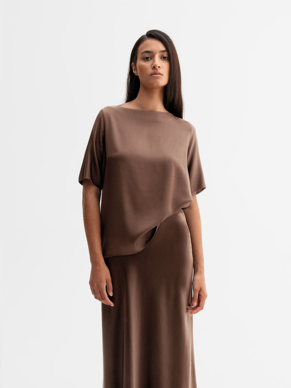 Model wearing Ahlvar Gallery Yoli silk blouse in Light brown