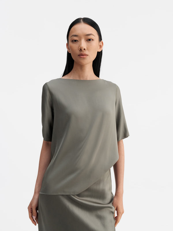 Model wearing Ahlvar Gallery Yoli silk blouse light military