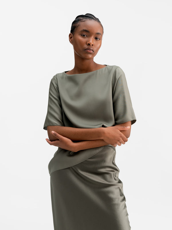 Model wearing Ahlvar Gallery Yoli silk blouse light military