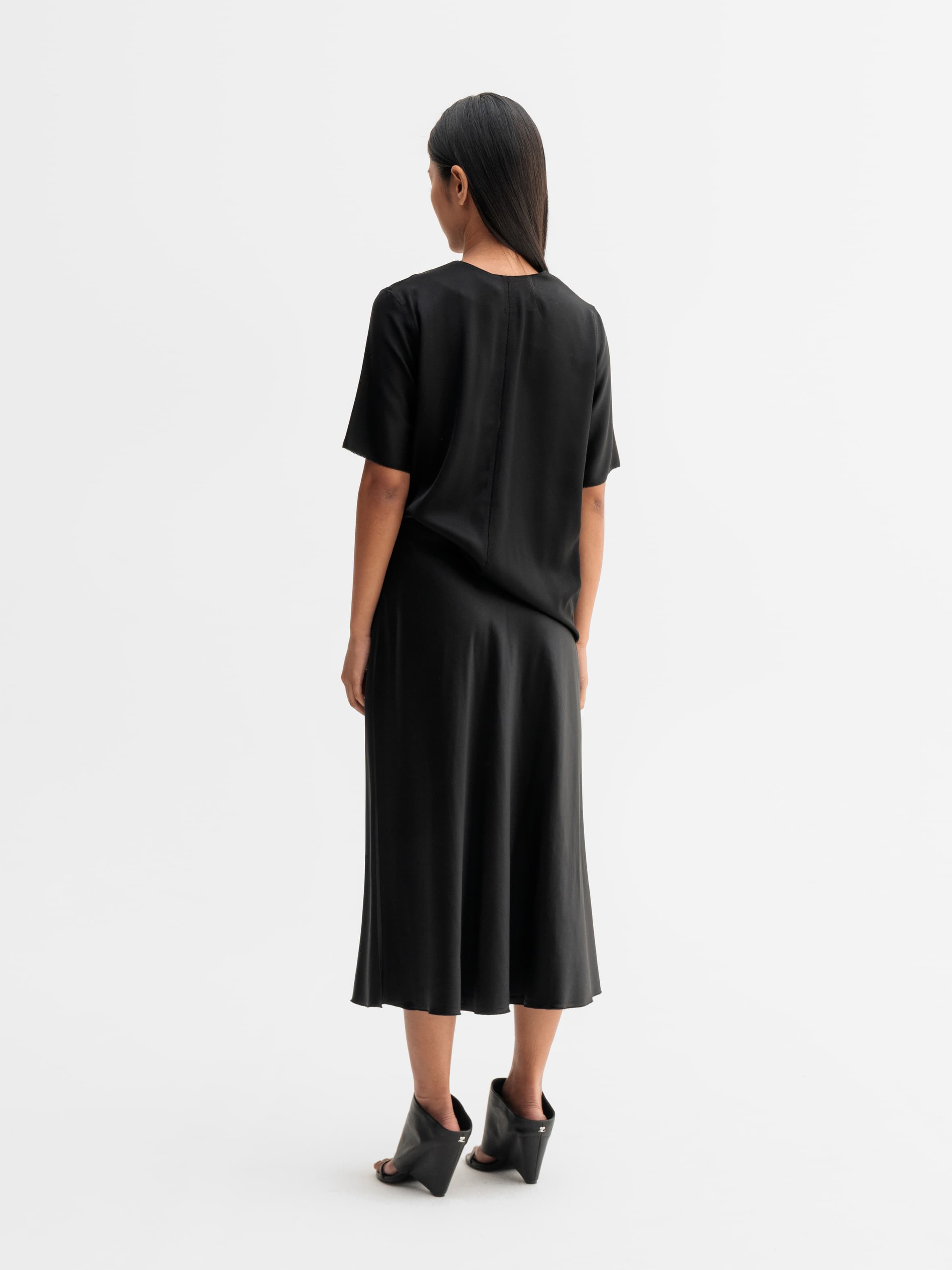 Back view of Ahlvar Gallery Yoli v-neck silk blouse in Black
