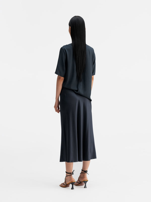 Back view of Ahlvar Gallery Yoli v-neck silk blouse blue grey