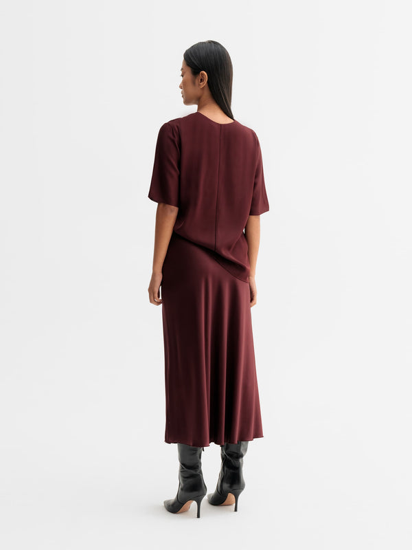 Back view of Ahlvar Gallery Yoli v-neck silk blouse in Burgundy