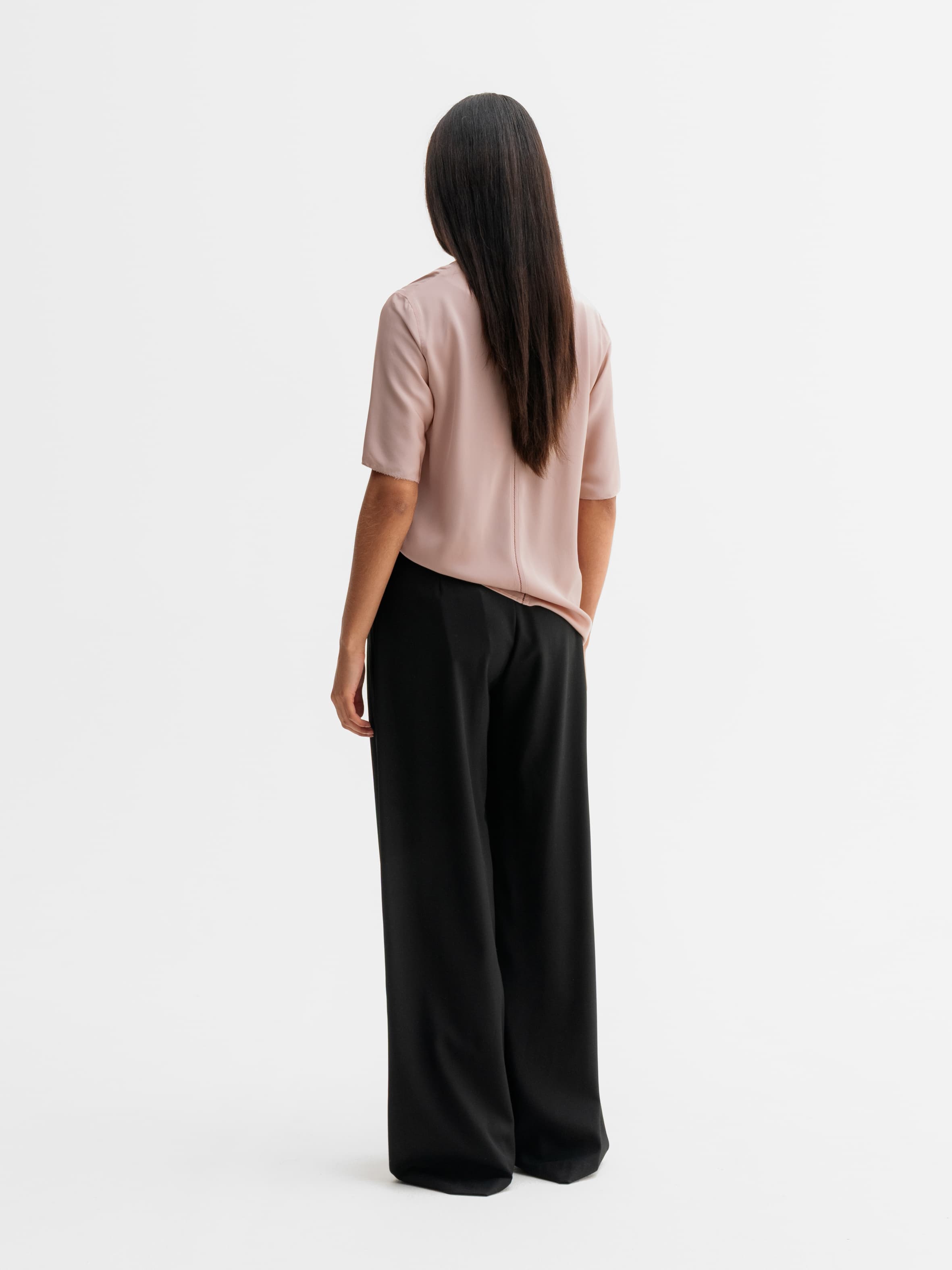 Back view of Ahlvar Gallery Yoli v-neck silk blouse in Dusty pink