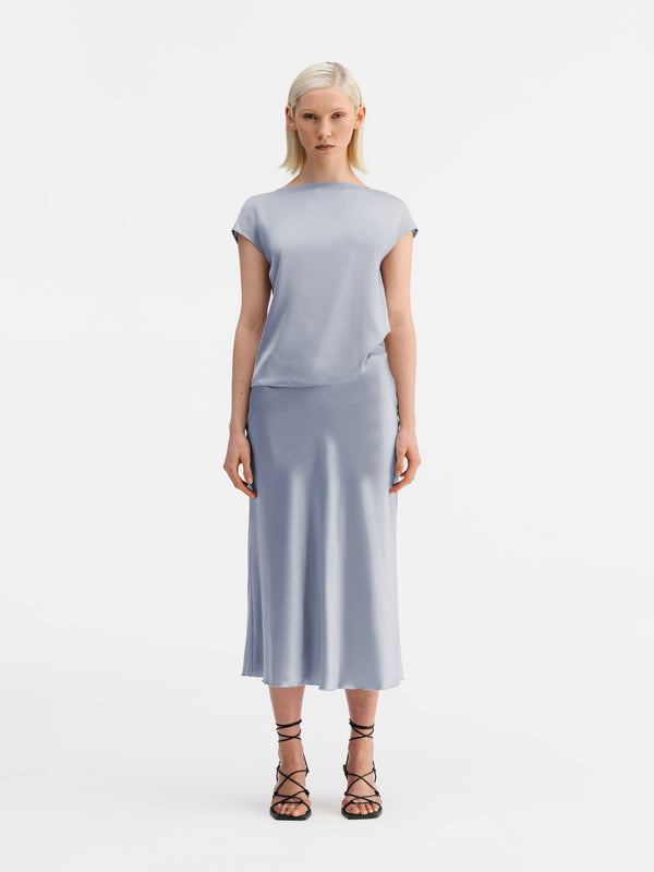 Model wearing Ahlvar Gallery Yui silk top denim blue