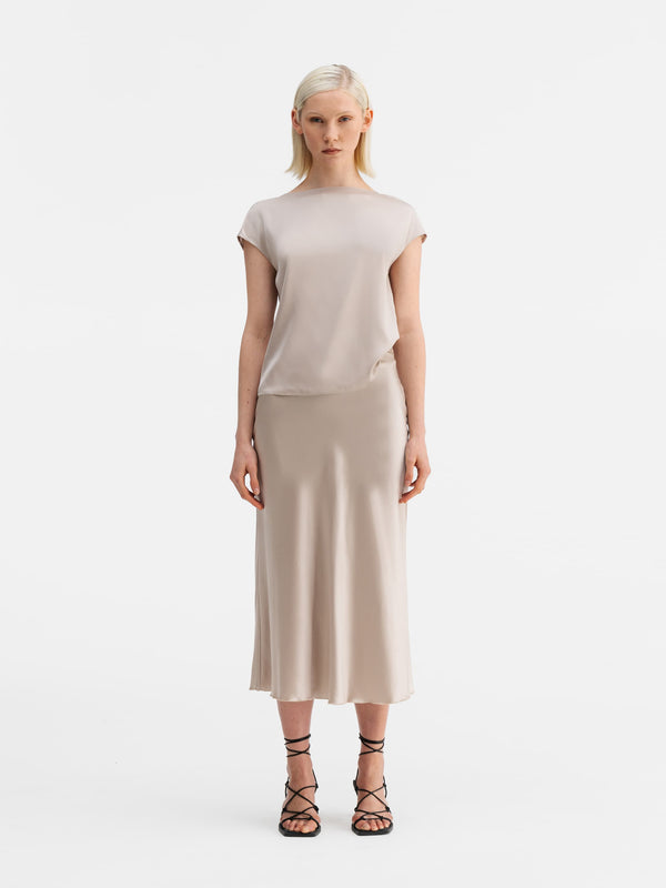 Model wearing Ahlvar Gallery Yui silk top greige