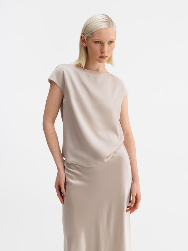 Model wearing Ahlvar Gallery Yui silk top greige
