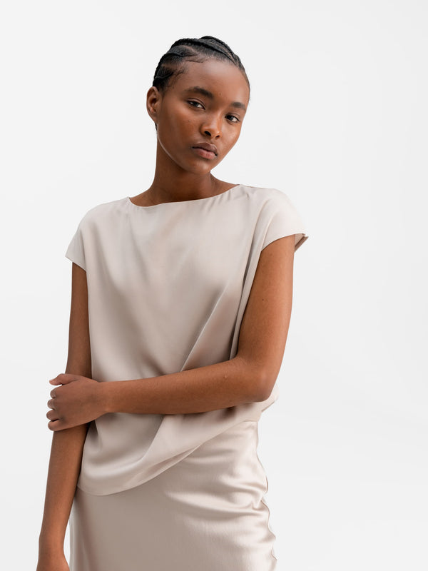 Model wearing Ahlvar Gallery Yui silk top greige