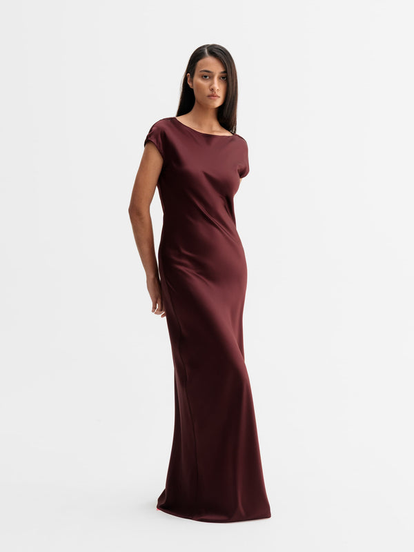 Model wearing Ahlvar Gallery Yuni satin dress in Burgundy