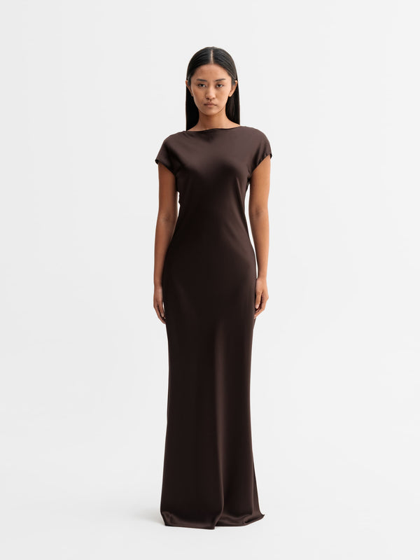 Model wearing Ahlvar Gallery Yuni satin dress in Dark brown