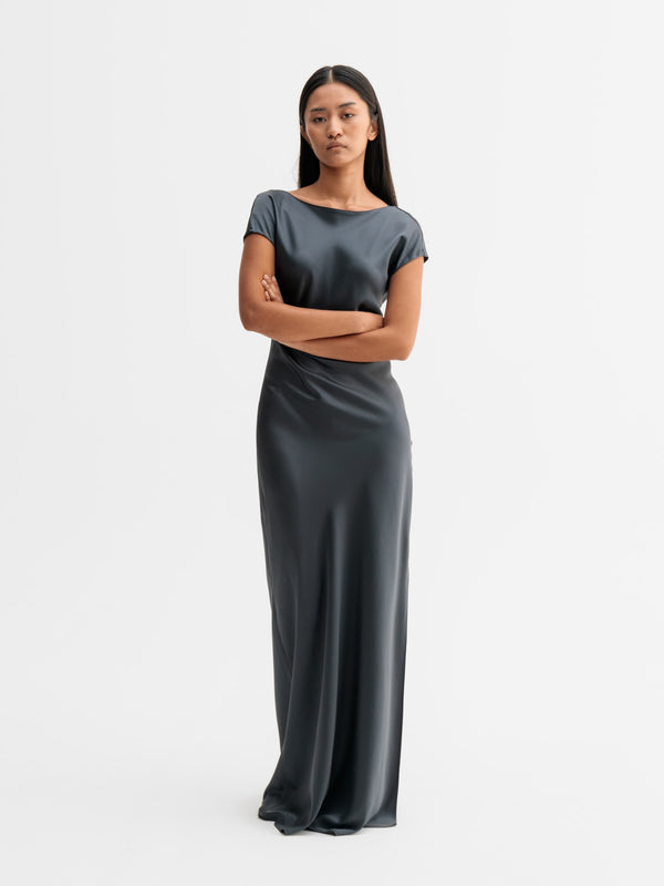 Model wearing Ahlvar Gallery Yuni satin dress in Dark grey